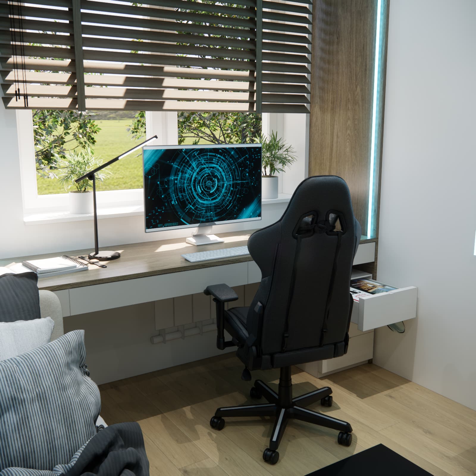 Desk beneath the window with a monitor, lamp, drawers and a black chair in a teenager’s room