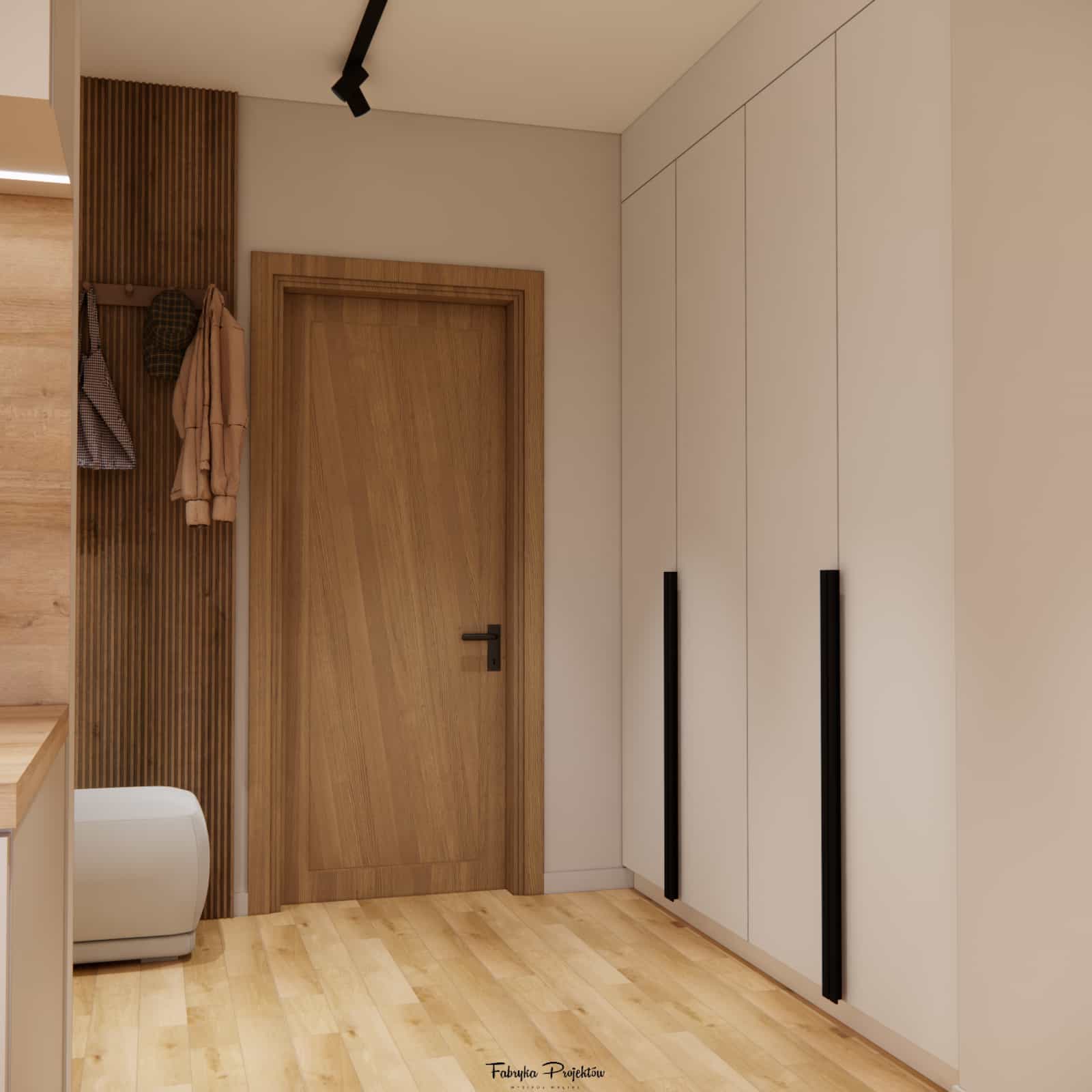 Hallway in a 35m2 apartment – functional built-in storage and mirror