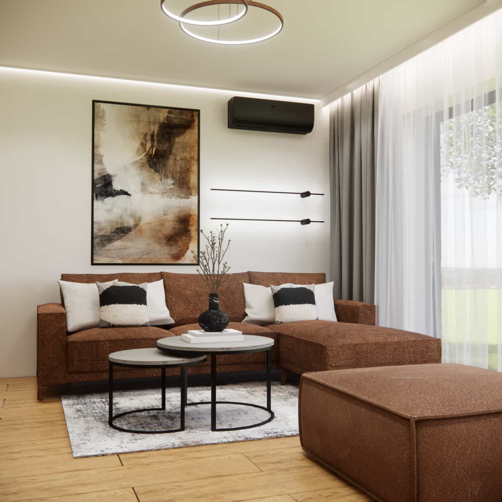 Strefa wypoczynkowa w salonie z aneksem kuchennym 50 m2 – sofa narożna, pufa i ciepła aranżacja wnętrza w kolorach drewna i szarości