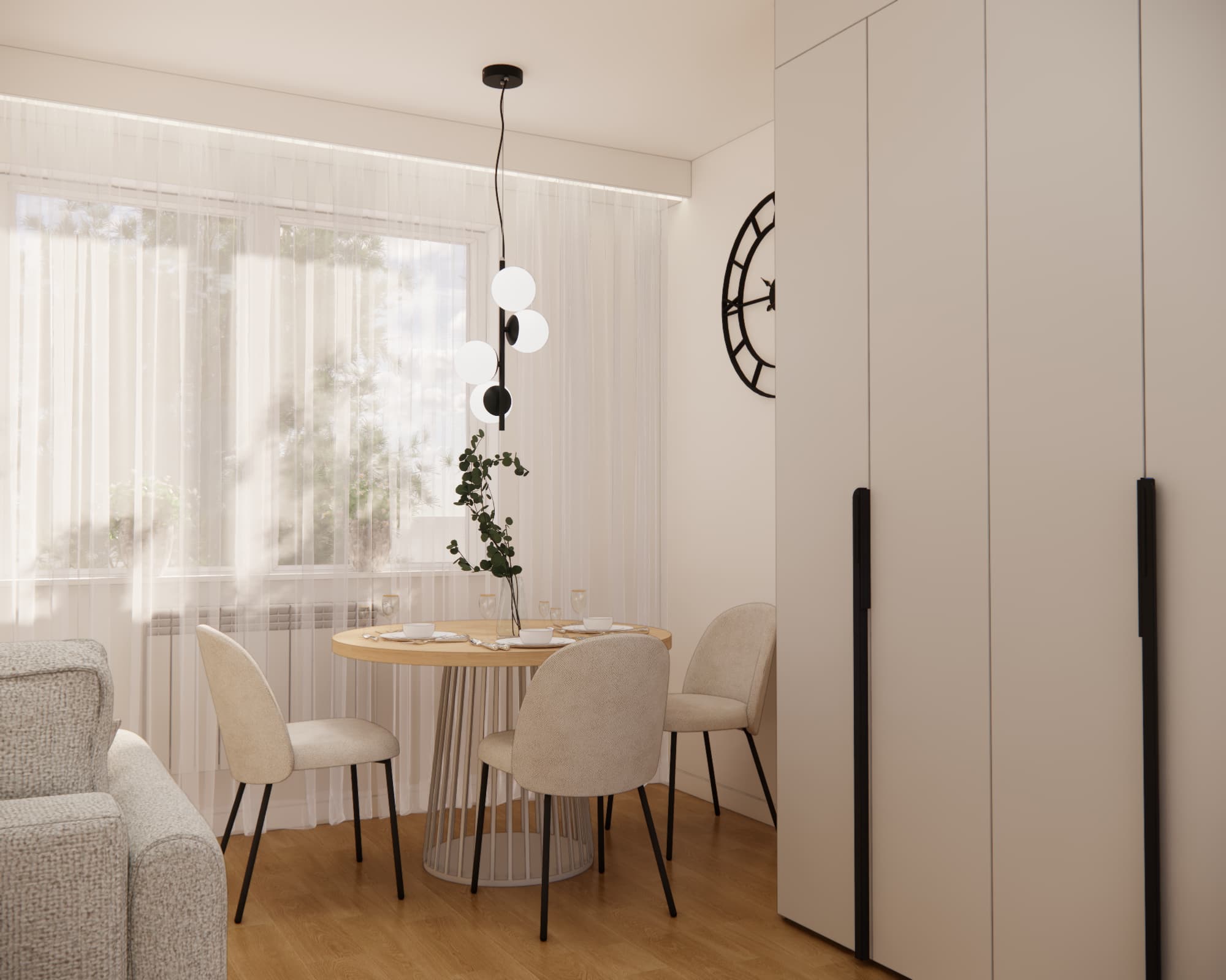 Dining area by the window with a round table and four light upholstered chairs