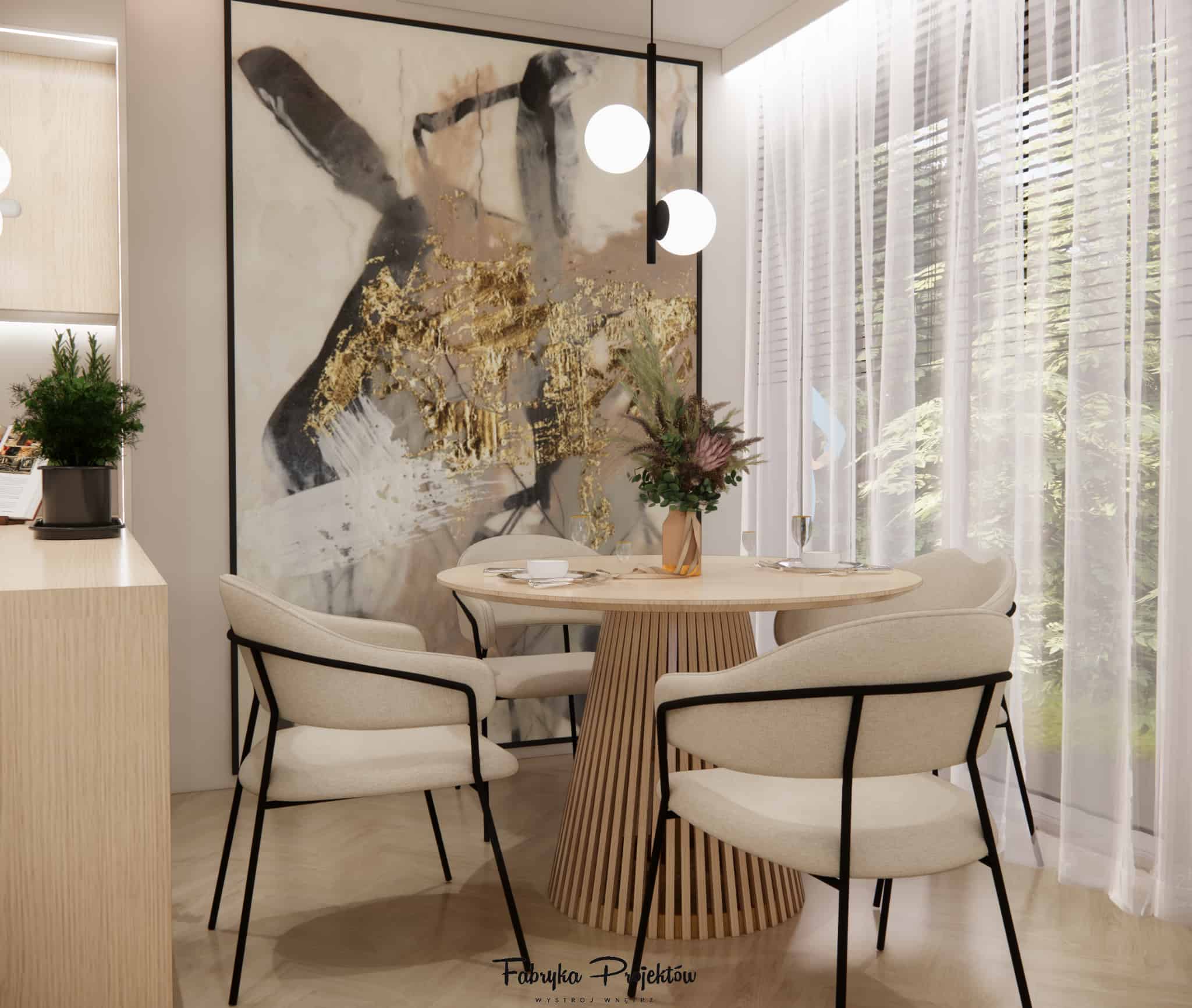 Round table with fluted base, beige chairs, decorative artwork and soft light in the dining area by a large window.