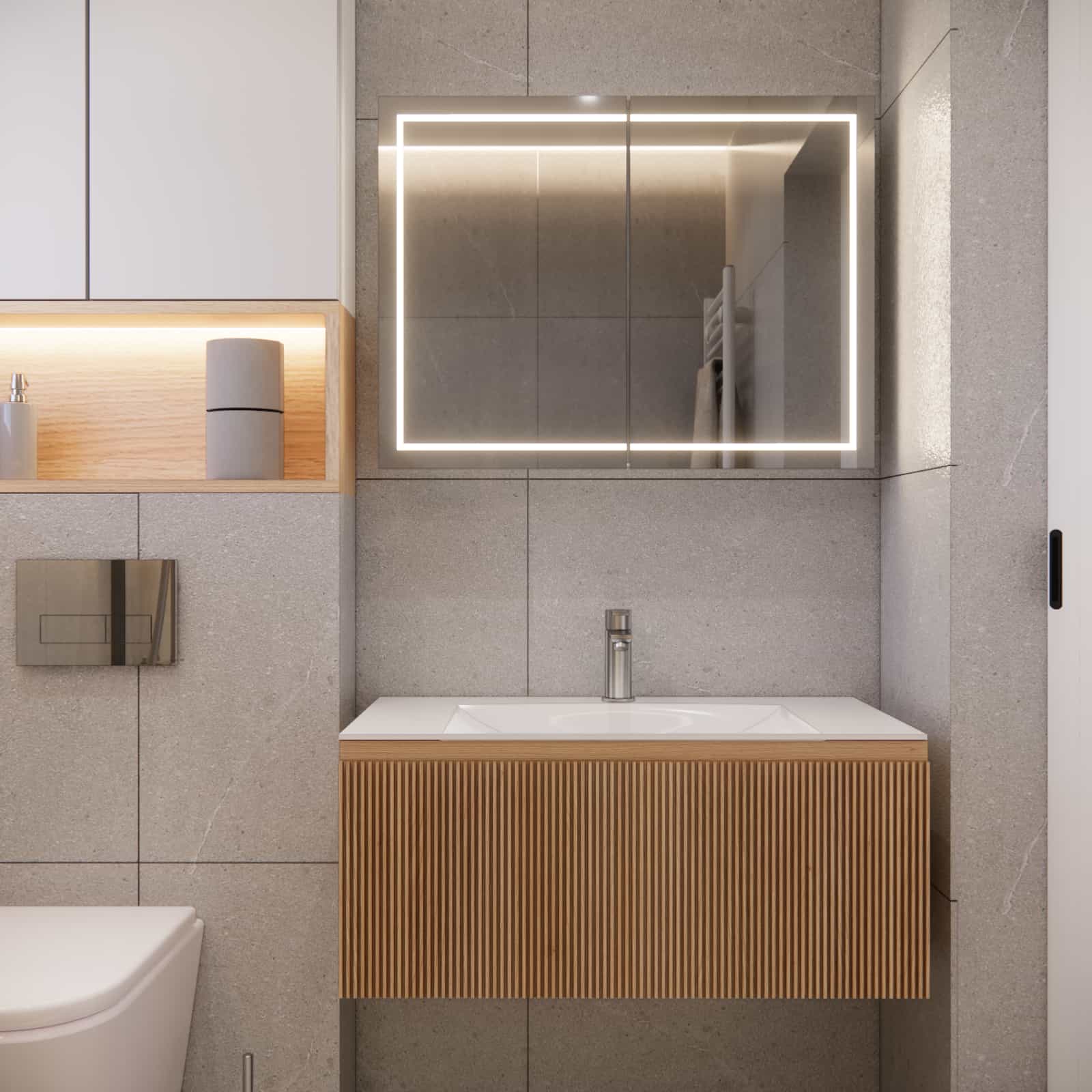Modern vanity with fluted front and LED-lit mirror in a 4m2 bathroom finished with grey stone-effect tiles.