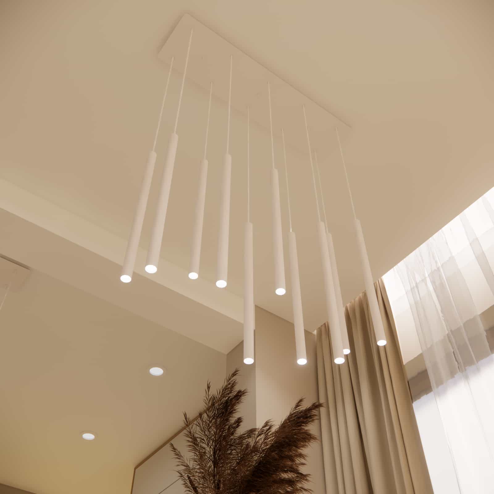 Dekoracyjne wiszące lampy nad stołem w minimalistycznej jadalni salonu z kuchnią 31m2.
