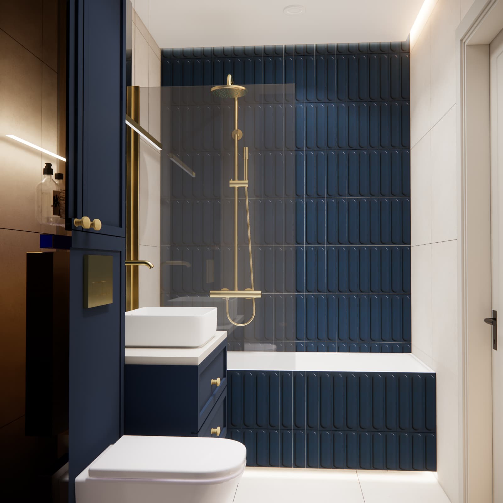 Bathtub with a glass screen against navy blue tiles and gold shower fittings