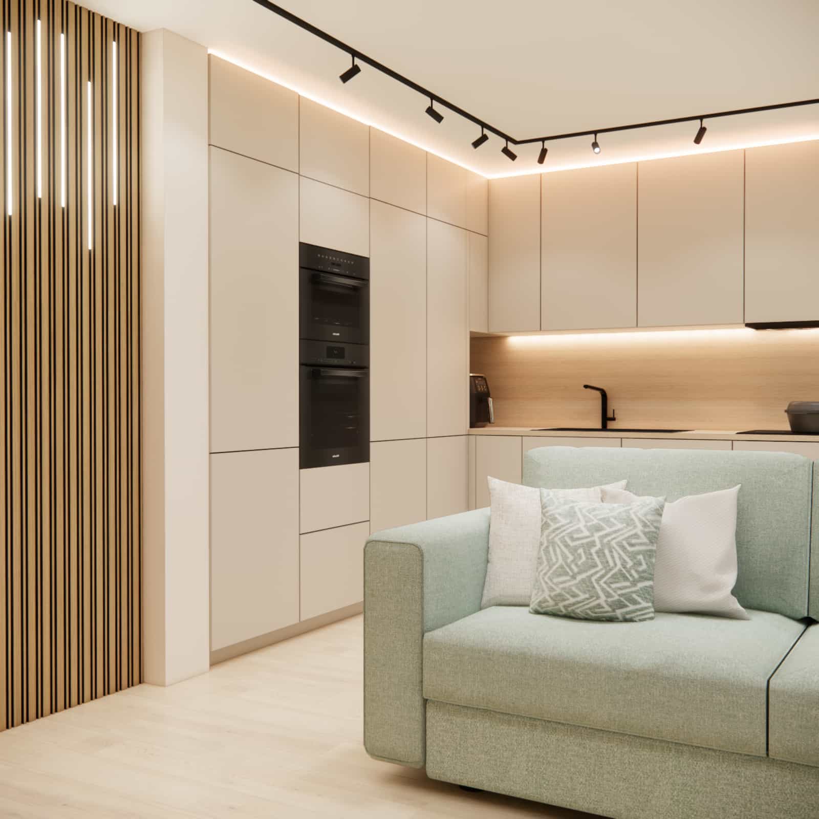zielona sofa w salonie z aneksem kuchennym – nowoczesna aranżacja wnętrza 22m2