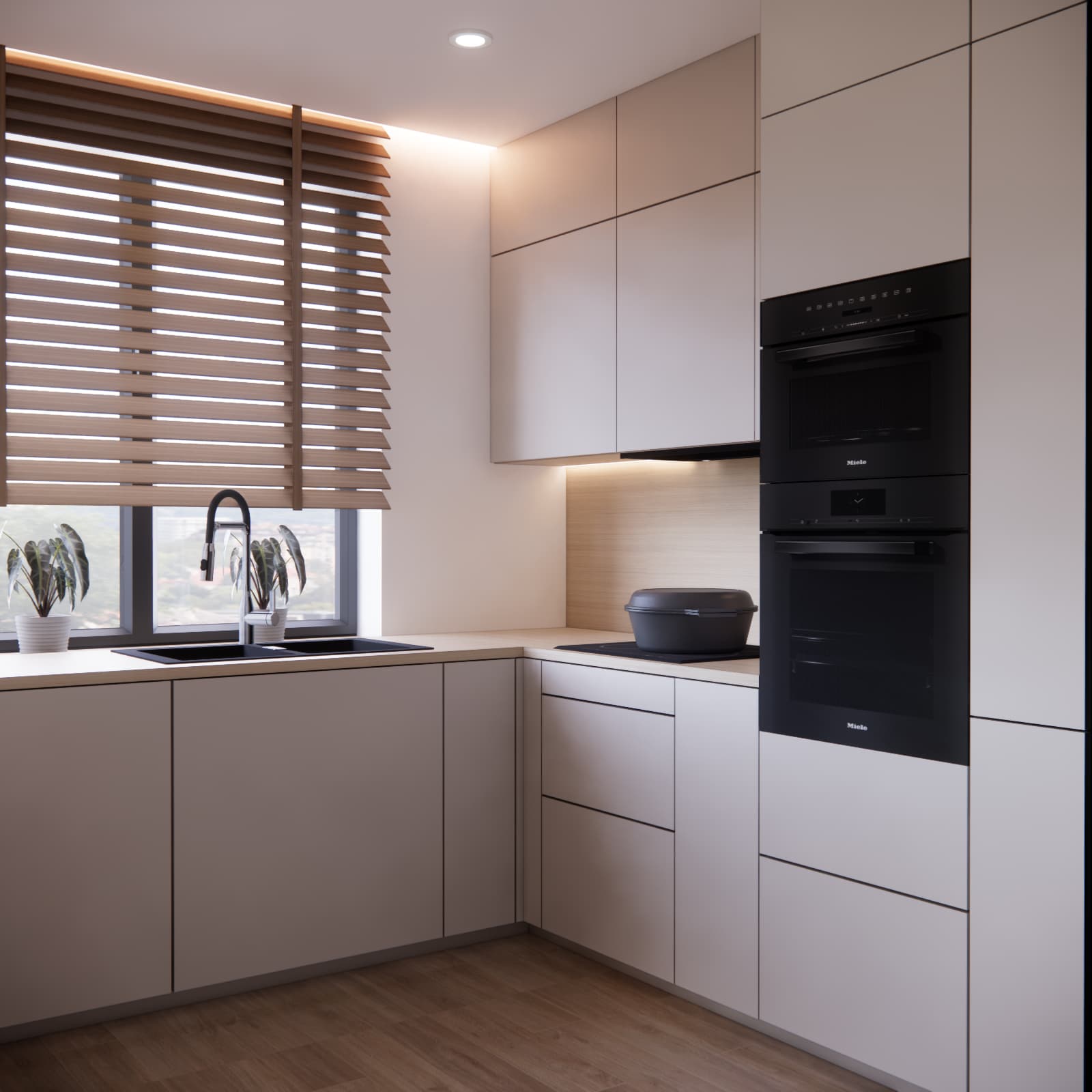 Light-coloured kitchen cabinetry with an oven and black appliances in an 11 m² kitchen