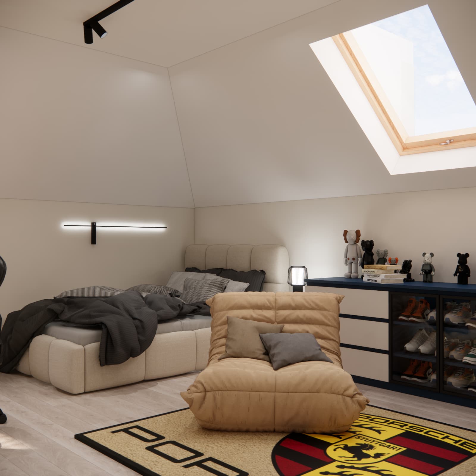 Light upholstered bed beneath a sloping ceiling with charcoal bedding and a horizontal wall light