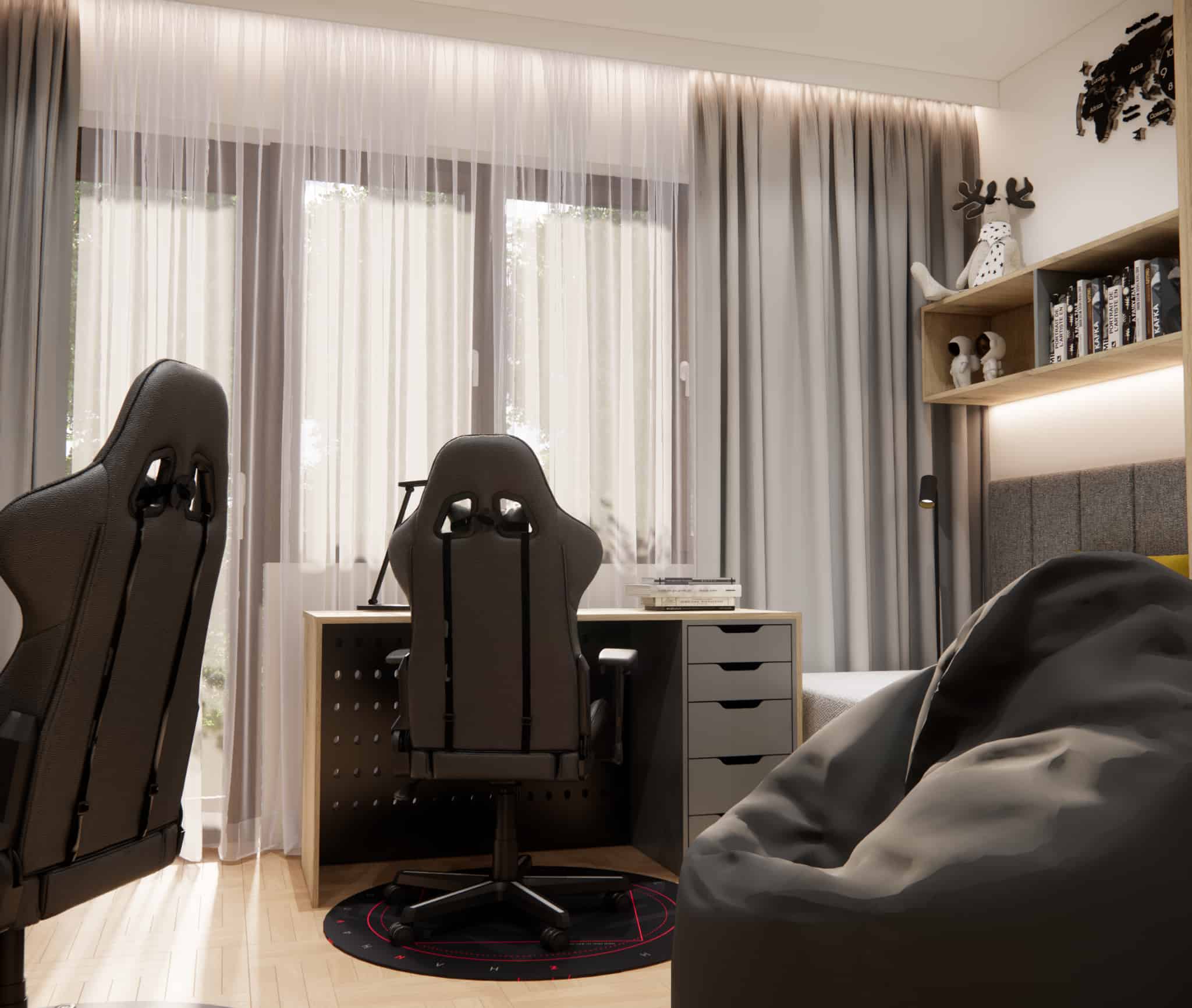 Close-up of two study stations with black gaming chairs and a pouf in a boys’ bedroom