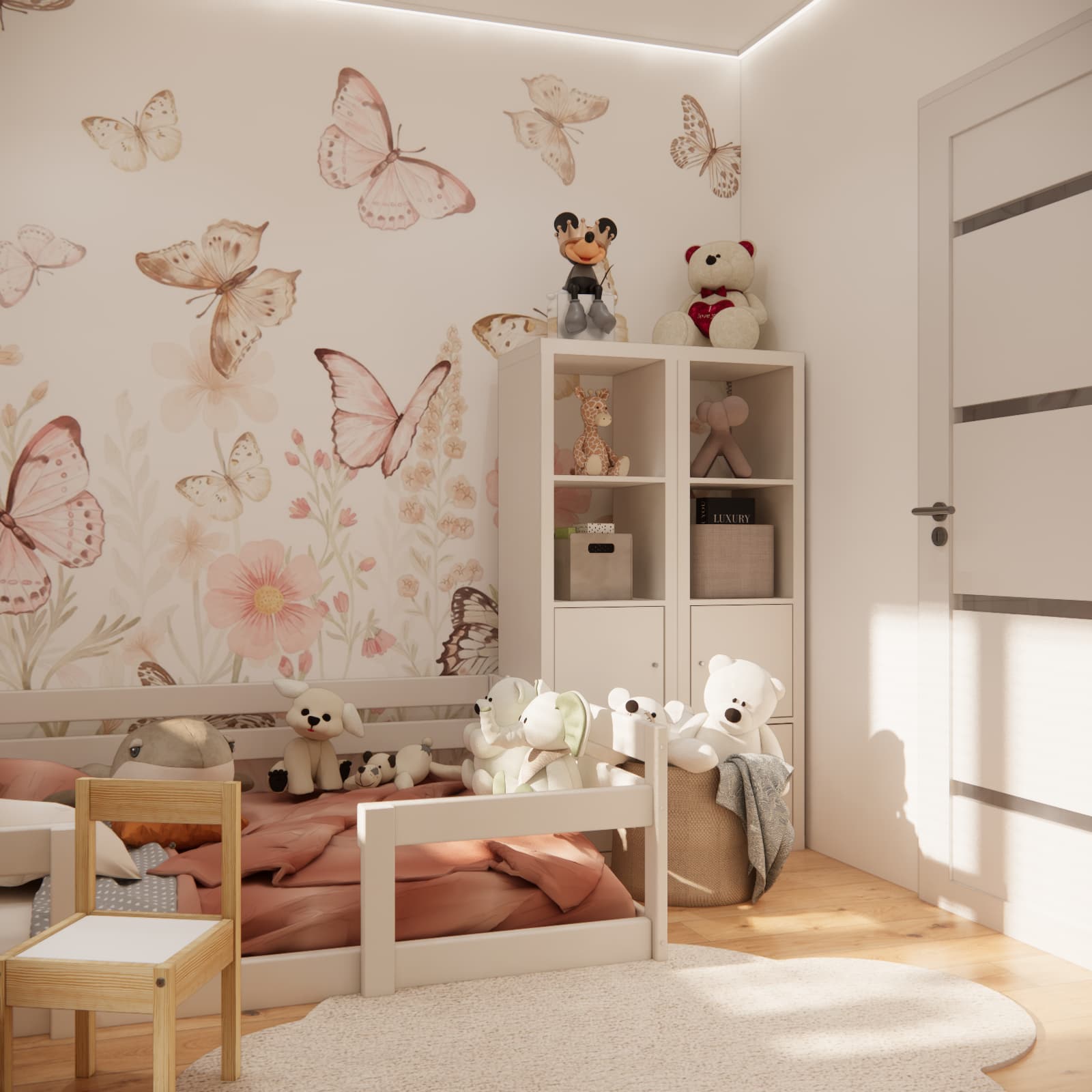 Wall with butterflies and flowers above the low bed in 2.5-year-old Emilia’s room