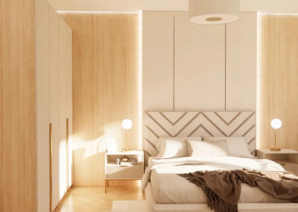 Bedroom 16 sqm with a workspace and a baby crib – a modern design in warm beige tones